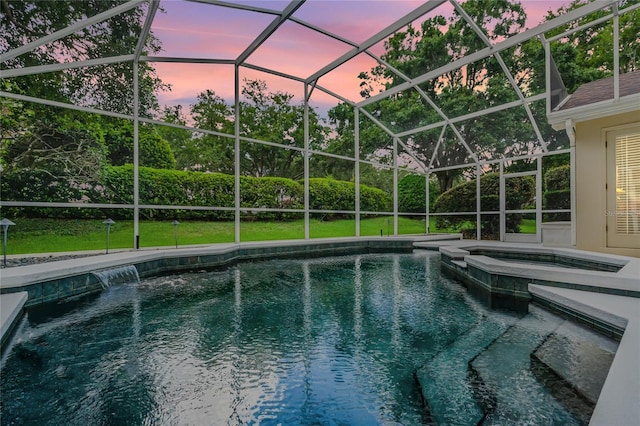 871 Paddington Ter, Lake Mary, FL 32746 - pool at dusk with a pool with connected hot tub, glass enclosure, and a yard