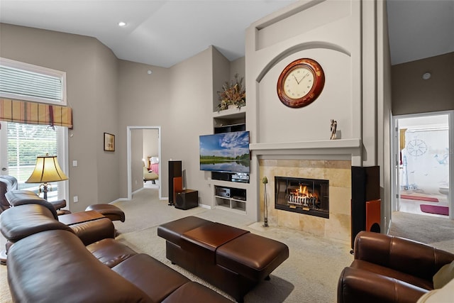 871 Paddington Ter, Lake Mary, FL 32746 - living room featuring carpet floors, a tile fireplace, and high vaulted ceiling