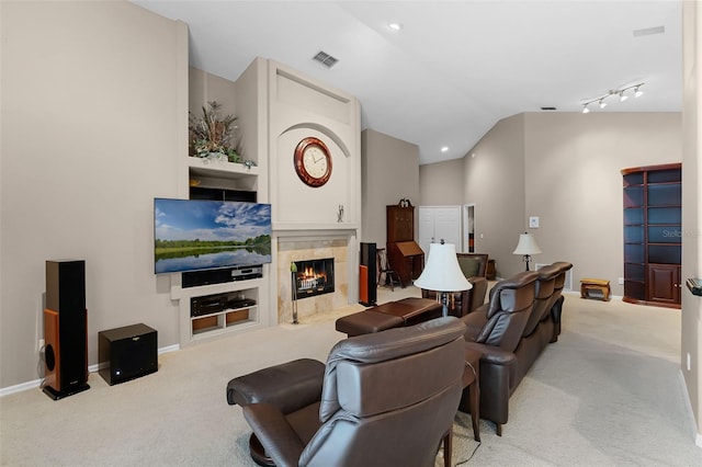 871 Paddington Ter, Lake Mary, FL 32746 - carpeted living room with a tiled fireplace and lofted ceiling