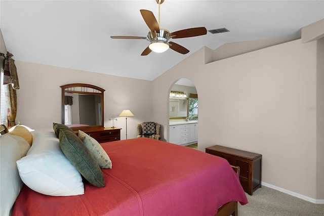 871 Paddington Ter, Lake Mary, FL 32746 - bedroom featuring lofted ceiling, carpet flooring, arched walkways, ensuite bath, and a ceiling fan