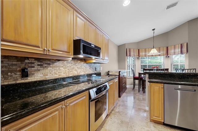 871 Paddington Ter, Lake Mary, FL 32746 - kitchen with stainless steel appliances, decorative backsplash, vaulted ceiling, dark stone countertops, and hanging light fixtures