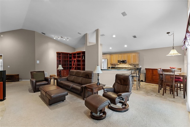 871 Paddington Ter, Lake Mary, FL 32746 - living area with lofted ceiling, light colored carpet, track lighting, and recessed lighting