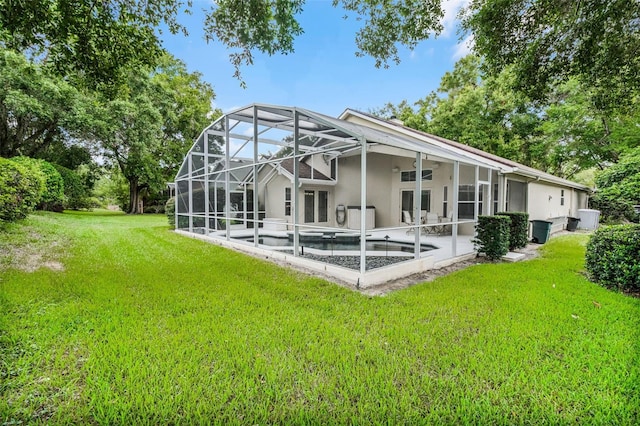 871 Paddington Ter, Lake Mary, FL 32746 - rear view of house with stucco siding, a patio, an outdoor pool, and a lawn
