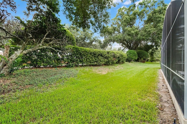 871 Paddington Ter, Lake Mary, FL 32746 - view of grassy yard with glass enclosure