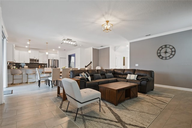 4185 Paragraph Dr, Kissimmee, FL 34746 - living area with recessed lighting, ornamental molding, stairway, a chandelier, and light tile patterned floors