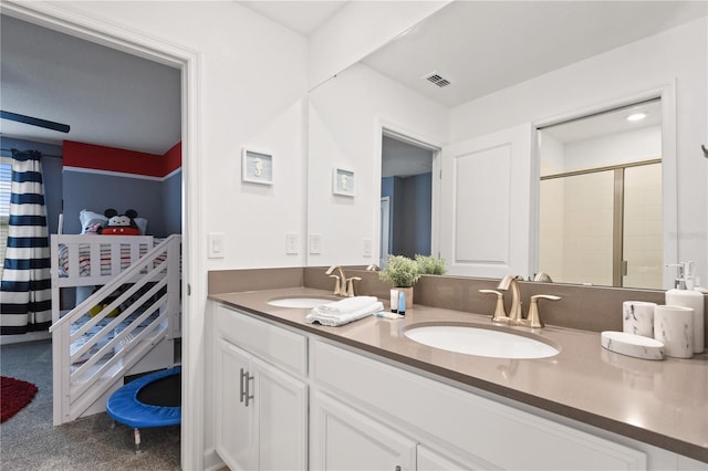 4185 Paragraph Dr, Kissimmee, FL 34746 - full bathroom with double vanity and a tile shower