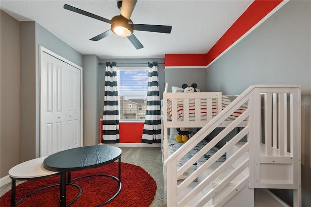 4185 Paragraph Dr, Kissimmee, FL 34746 - carpeted bedroom featuring a closet and ceiling fan