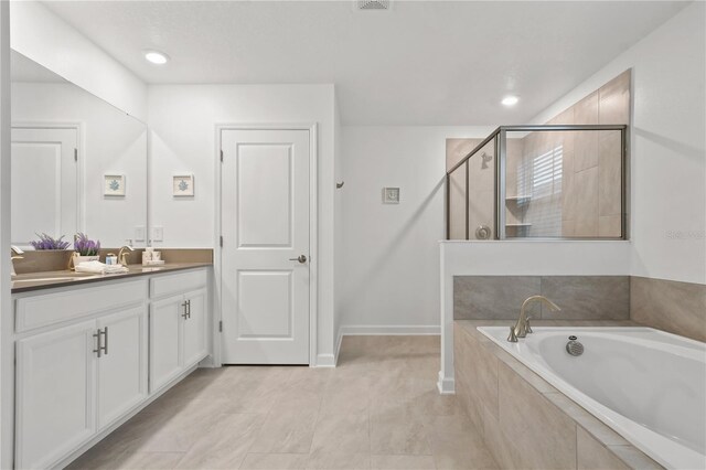 4185 Paragraph Dr, Kissimmee, FL 34746 - full bathroom with vanity, a bath, a stall shower, and recessed lighting