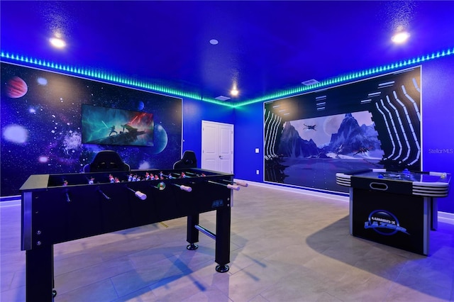 4185 Paragraph Dr, Kissimmee, FL 34746 - recreation room featuring an accent wall, wallpapered walls, and recessed lighting