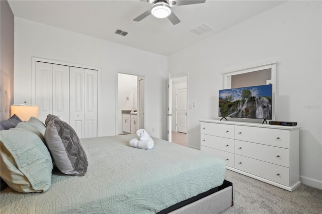 4185 Paragraph Dr, Kissimmee, FL 34746 - bedroom with light colored carpet, a closet, a ceiling fan, and ensuite bath