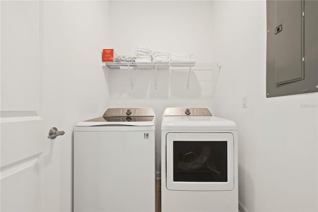 4185 Paragraph Dr, Kissimmee, FL 34746 - laundry room with electric panel and washer and dryer