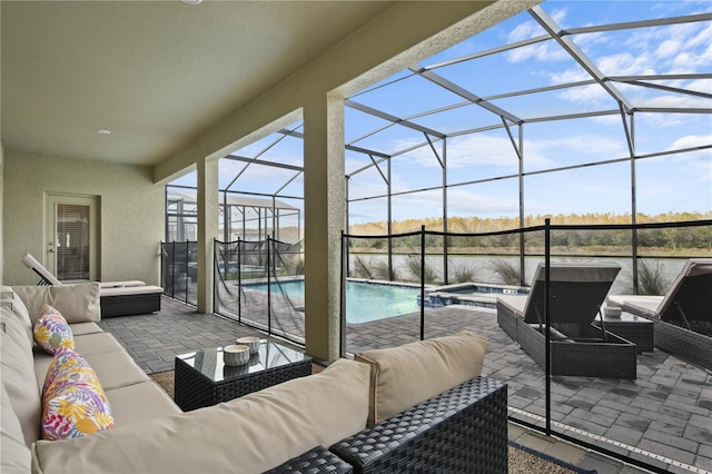 4185 Paragraph Dr, Kissimmee, FL 34746 - view of patio / terrace featuring an outdoor living space, a water view, a pool with connected hot tub, and a lanai