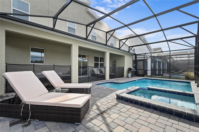 4185 Paragraph Dr, Kissimmee, FL 34746 - view of pool featuring a patio area, a pool with connected hot tub, grilling area, and glass enclosure
