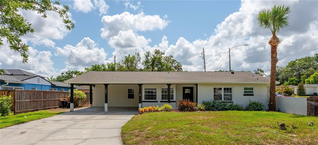 1801 Palm Ln, Orlando, FL 32803 - single story home with driveway and an attached carport