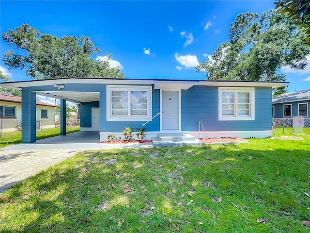 207 Kay St, Auburndale, FL 33823 - view of front of house featuring concrete driveway and a carport