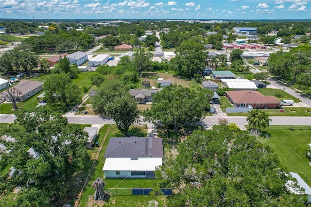 207 Kay St, Auburndale, FL 33823 - aerial overview of property's location featuring nearby suburban area and a tree filled landscape