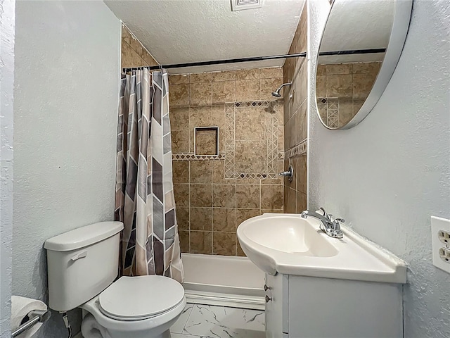 207 Kay St, Auburndale, FL 33823 - bathroom featuring a textured ceiling, a textured wall, vanity, tiled shower, and marble look tiles