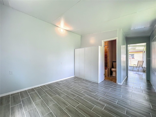207 Kay St, Auburndale, FL 33823 - unfurnished bedroom featuring a closet and wood finish floors