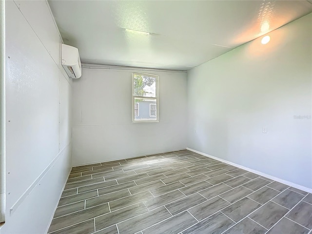 207 Kay St, Auburndale, FL 33823 - unfurnished room with a wall unit AC and wood tiled floors