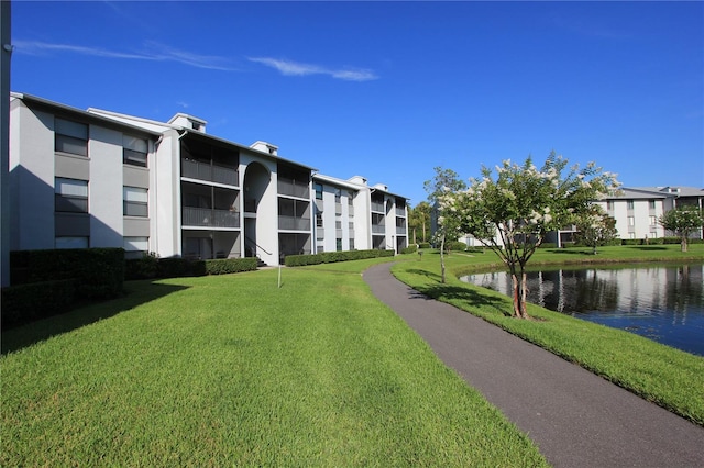 1131 S Pine Ridge Cir Unit 1, Sanford, FL 32773 - surrounding community featuring a lawn and a water view