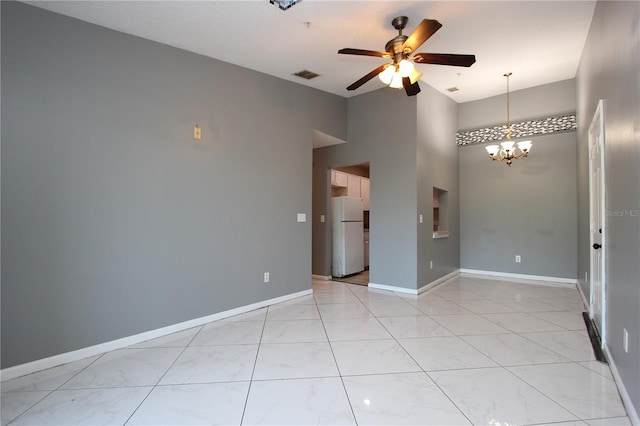 1131 S Pine Ridge Cir Unit 1, Sanford, FL 32773 - spare room with ceiling fan, a chandelier, and a high ceiling