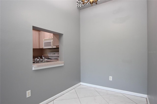1131 S Pine Ridge Cir Unit 1, Sanford, FL 32773 - spare room with light marble finish floors and baseboards