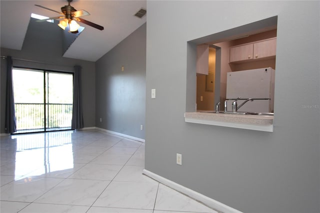 1131 S Pine Ridge Cir Unit 1, Sanford, FL 32773 - empty room featuring ceiling fan, light marble finish floors, and vaulted ceiling