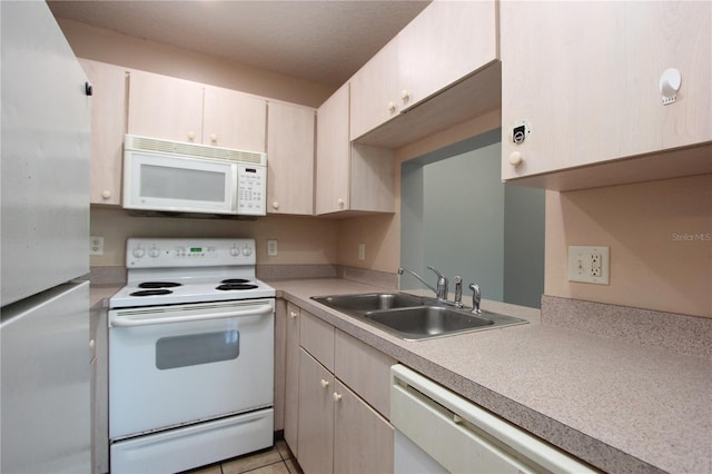 1131 S Pine Ridge Cir Unit 1, Sanford, FL 32773 - kitchen with white appliances, light countertops, and light tile patterned floors