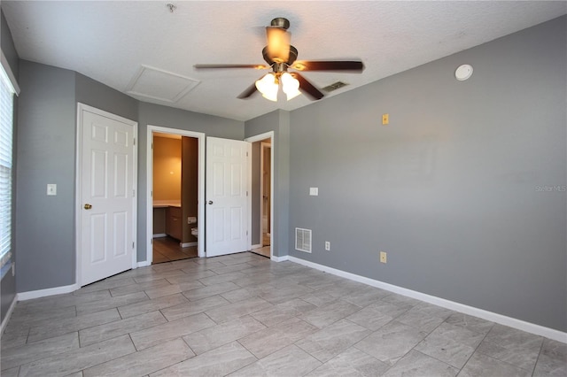 1131 S Pine Ridge Cir Unit 1, Sanford, FL 32773 - unfurnished bedroom featuring attic access, connected bathroom, and a ceiling fan