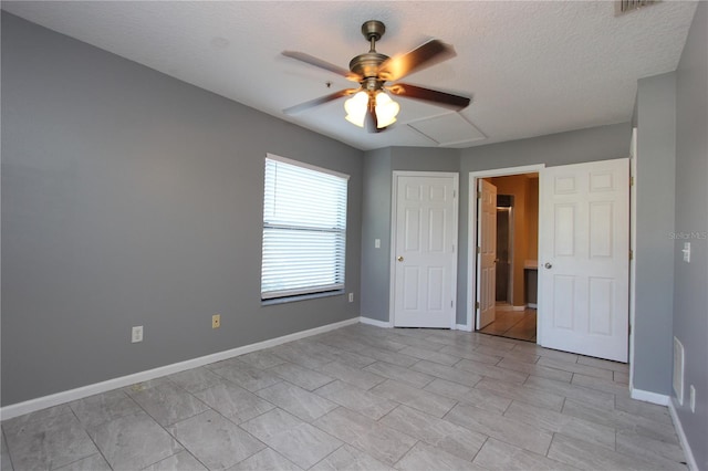 1131 S Pine Ridge Cir Unit 1, Sanford, FL 32773 - unfurnished bedroom with a textured ceiling and ceiling fan