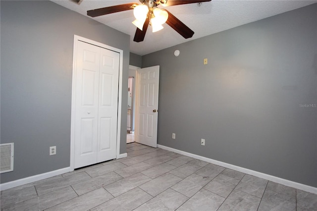 1131 S Pine Ridge Cir Unit 1, Sanford, FL 32773 - unfurnished bedroom featuring a closet and a ceiling fan