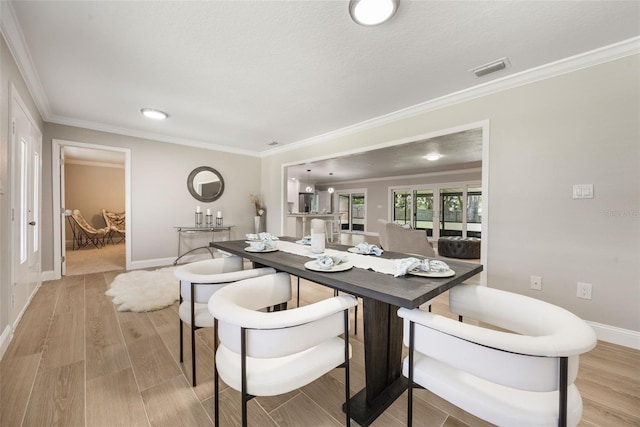 102 Linda Ln, Lake Mary, FL 32746 - dining space featuring light wood finished floors and ornamental molding