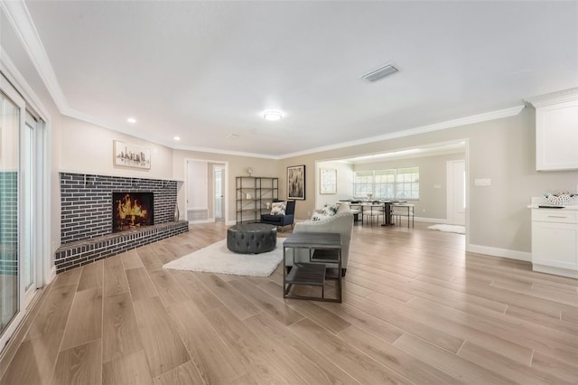 102 Linda Ln, Lake Mary, FL 32746 - living area with light wood-style floors, crown molding, a fireplace, and recessed lighting
