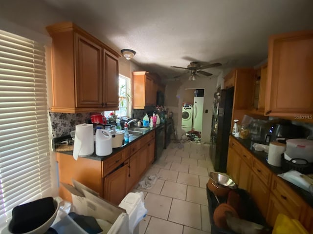 3810 SE 22nd Pl, Ocala, FL 34471 - kitchen with washer and dryer, ceiling fan, tasteful backsplash, dark countertops, and dishwashing machine