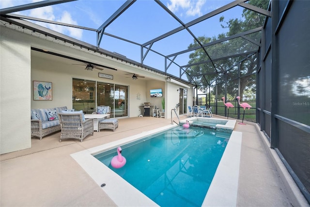 1962 Flora Pass Pl, Kissimmee, FL 34747 - view of pool featuring ceiling fan, a patio, glass enclosure, a pool with connected hot tub, and an outdoor hangout area