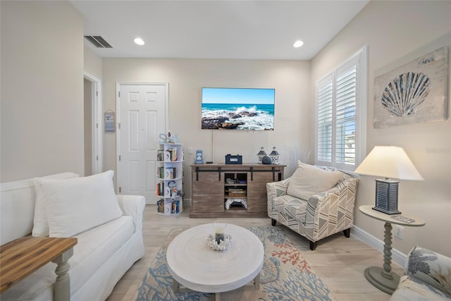 1962 Flora Pass Pl, Kissimmee, FL 34747 - living room featuring light wood-style floors and recessed lighting