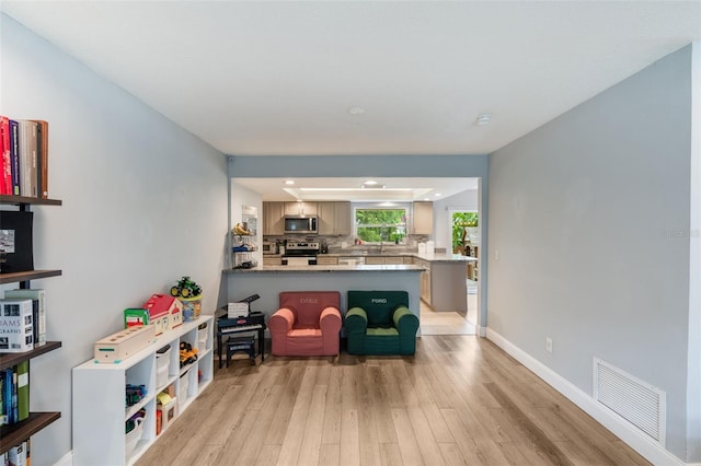 209 Carriage Hill Dr, Casselberry, FL 32707 - sitting room featuring light wood-style floors and baseboards