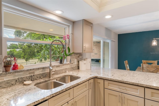 209 Carriage Hill Dr, Casselberry, FL 32707 - kitchen with tasteful backsplash, light stone countertops, and recessed lighting