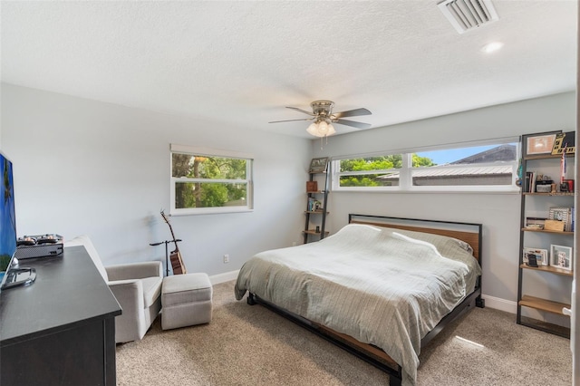 209 Carriage Hill Dr, Casselberry, FL 32707 - bedroom featuring light carpet, a textured ceiling, a ceiling fan, and an office area