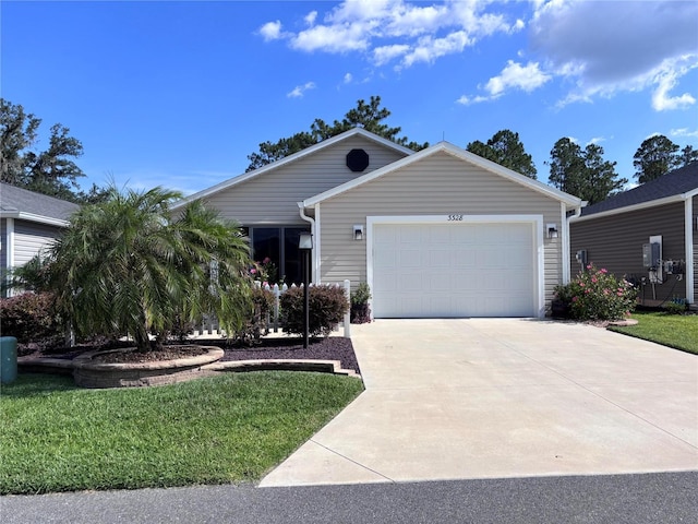 3328 Davis Ter, The Villages, FL 32163 - ranch-style house with driveway, a garage, and a front yard