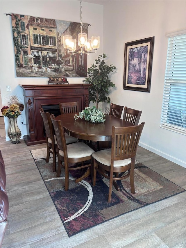 3328 Davis Ter, The Villages, FL 32163 - dining area with a chandelier and wood finished floors