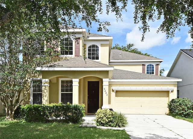 9223 Leeland Archer Blvd, Orlando, FL 32836 - traditional-style home with a garage, stucco siding, concrete driveway, and a shingled roof