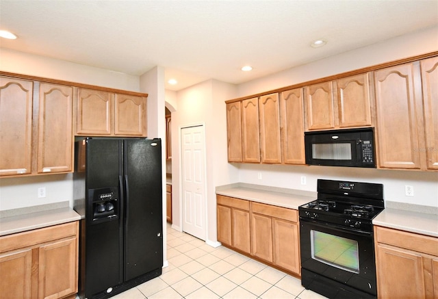 9223 Leeland Archer Blvd, Orlando, FL 32836 - kitchen with black appliances, arched walkways, light tile patterned floors, light countertops, and recessed lighting