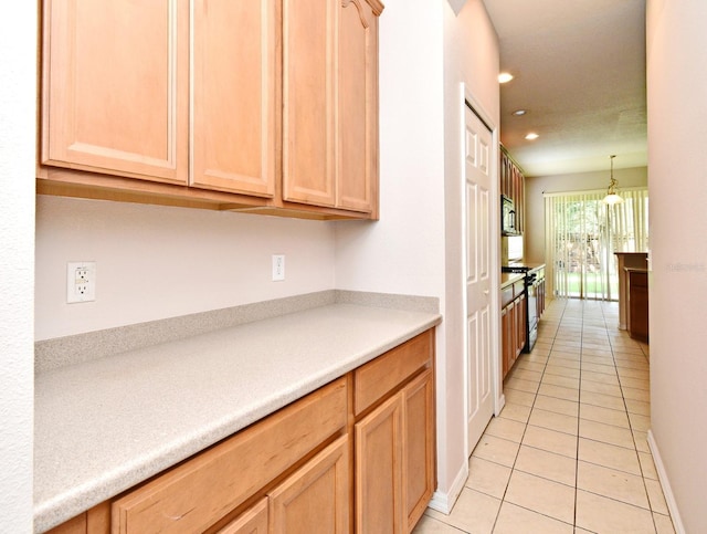 9223 Leeland Archer Blvd, Orlando, FL 32836 - kitchen featuring stove, light brown cabinetry, and recessed lighting