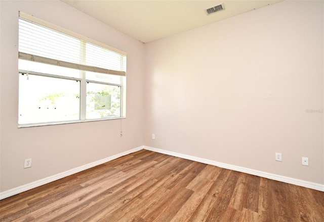 9223 Leeland Archer Blvd, Orlando, FL 32836 - unfurnished room with baseboards and wood finished floors