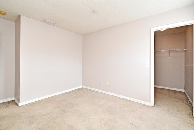 9223 Leeland Archer Blvd, Orlando, FL 32836 - unfurnished bedroom with carpet flooring, a walk in closet, and a closet