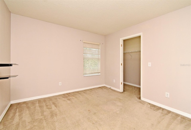 9223 Leeland Archer Blvd, Orlando, FL 32836 - unfurnished bedroom featuring carpet, a spacious closet, and a closet
