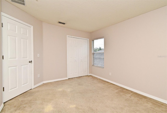 9223 Leeland Archer Blvd, Orlando, FL 32836 - unfurnished bedroom with light colored carpet and a closet