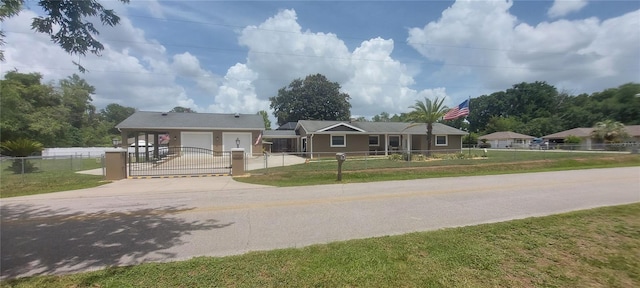 13785 SE 39th Ter, Summerfield, FL 34491 - single story home featuring driveway, a fenced front yard, and a gate