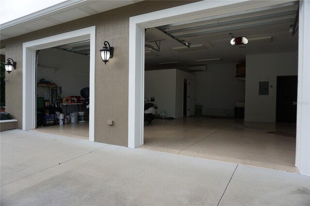 13785 SE 39th Ter, Summerfield, FL 34491 - garage featuring a garage door opener, electric panel, and a wall unit AC